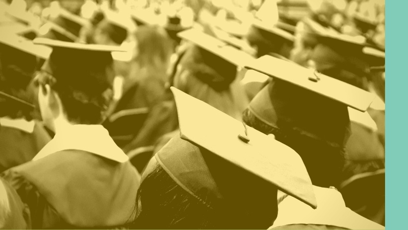 Group of college graduates facing away from camera.