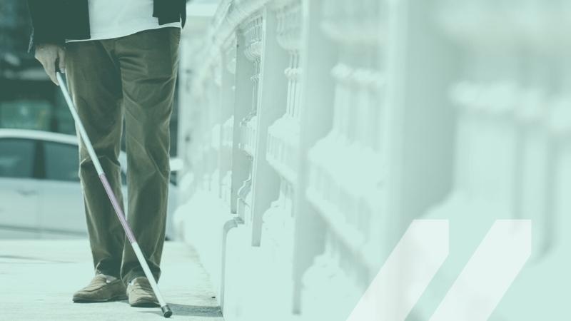 Image of a blind man using a cane