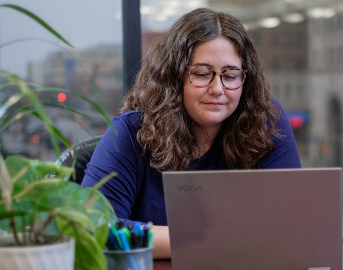 Kiersten Nolan looking at a laptop
